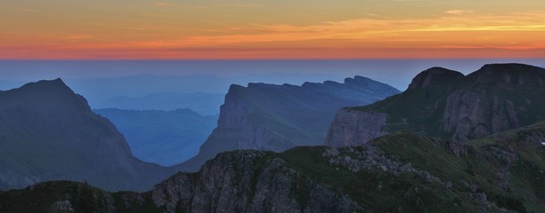 Sunrise view from Mount Niederhorn. Mountain ranges in the Bernese Oberland. Valley named Justistal. 
