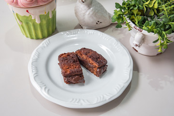 Mini chocolate cake - With plate and white background on a decorated table