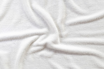 Fototapeta premium White towel texture for background. That fabric or textile consist of cotton fiber material. Look plush, fluffy, dry, soft and clean. For background about baby, spa, hotel, laundry and hygiene etc.