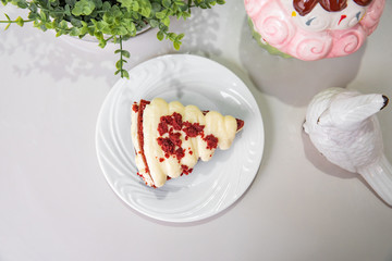 Mini red velvet cake - With plate and white background on a decorated table - Top view