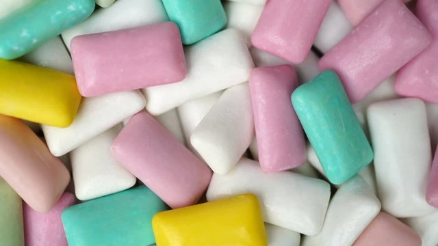 Footage different colors chewing gum rotate