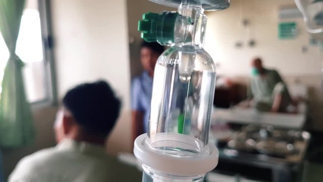 saline solution for patient with sick in the hospital , Patient in the hospital receives a solution from the dripping machine.