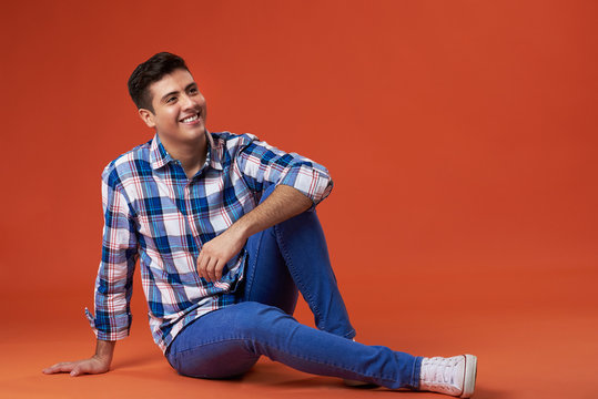 Young Man Sit On Studio Floor