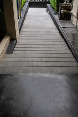 Ramped access, using wheelchair ramp with information sign on floor background