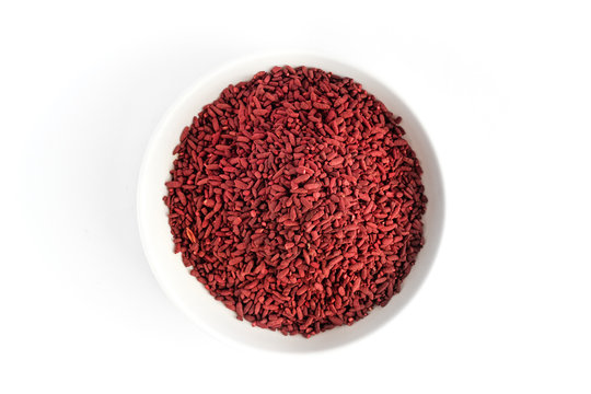 Red yeast fermented rice on white plate