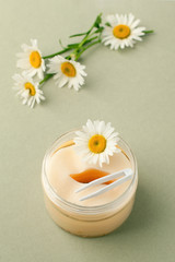 Plant-based beauty products. Eyes pads with herbal extract, camomile flowers, concept of organic plant cosmetics product.