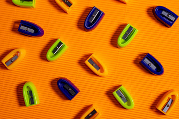 education equipment on orange background.