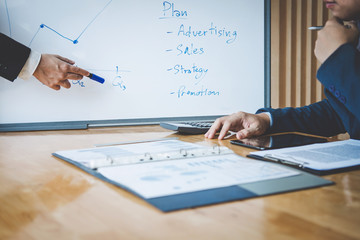 Teamwork process, Business team are presentation marketing plan strategy report analyzing financial...