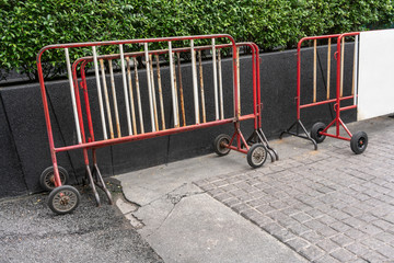 Red and white steel barrier with wheels for no passing on road