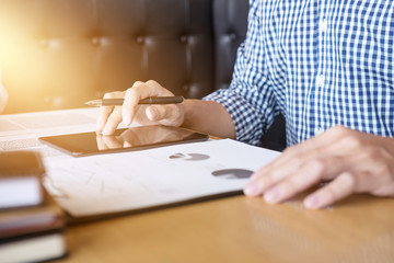 Business man or accountant working Financial investment on digital tablet, financial document data...