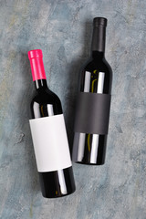 Flat lay of lying wine bottles with empty labels