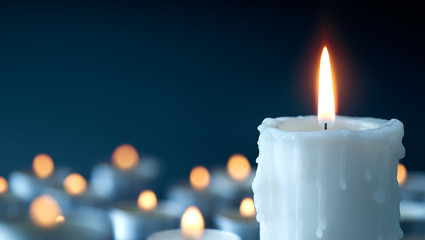 Melting candle on cool blue background - Powered by Adobe