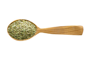 dried oregano in wooden spoon isolated on white background. spice for cooking food, top view.