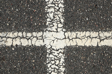 Fototapeta na wymiar Old asphalt with paint