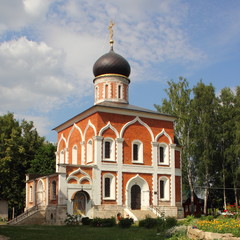 Fototapeta na wymiar Russia, Mozhaisk Kremlin, region landmark Peter and Paul Church on a summer day against the blue sky with clouds – medieval architecture, old buildings, christianity, red brown cathedral