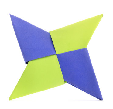 Origami star shape paper fold on a white background.