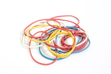 Stationery, colored rubber bands isolated in a white background