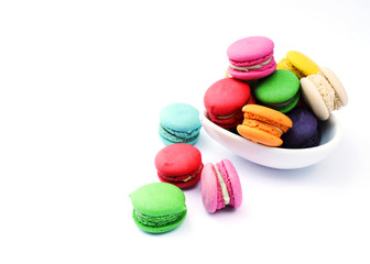 Tasty mini french macaroon cookie with blow on white backgrounds