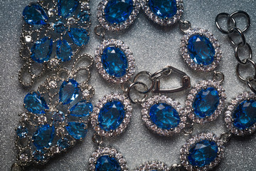 Silver bracelet and earring with tanzanite