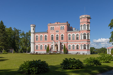 Fototapeta na wymiar Birini, Latvia. The beautiful castle and the green park around it.