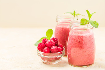 Raspberry smoothie close up photography with fresh summer blended cocktail and ripe berries.