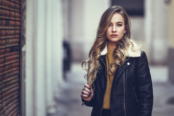 Beautiful blonde russian woman in urban background