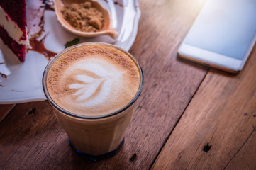 coffee cappucino cup and cake on wood table classic style in coffee shop