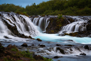 Fototapeta na wymiar Bruarfoss waterfall. The Blue waterfall in Iceland.
