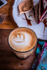 coffee cappucino cup and cake on wood table classic style in coffee shop