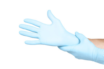 Doctor putting on blue sterilised medical glove for making operation