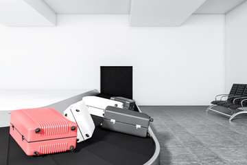 Fototapeta premium Pink, white suitcases on airport conveyor belt