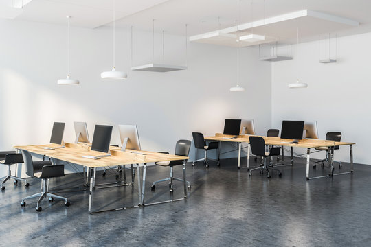 Wooden tables in modern company office