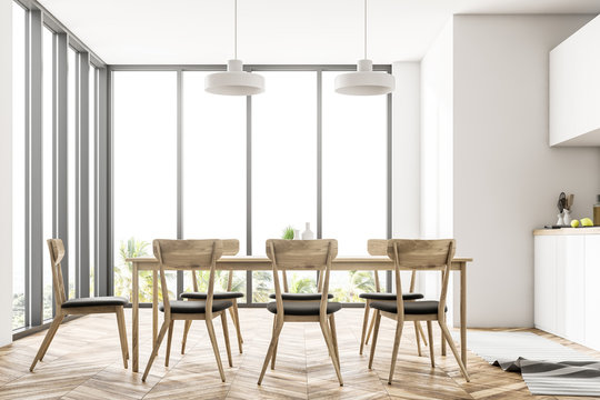 White panoramic dining room and kitchen interior