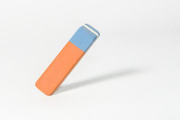 Eraser stands at an angle against a light background
