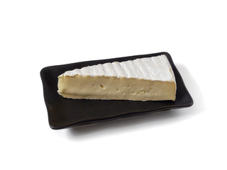 Soft cheese on a dark plate