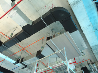 Installation of airconditioner ducting and chiller pipes system and hung it at the concrete slab....