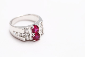 Pink gem stone on diamond ring