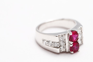 Pink gem stone on diamond ring