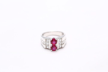 Pink gem stone on diamond ring