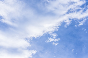 Blue sky and large white cloud.