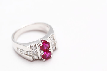 Pink gem stone on diamond ring
