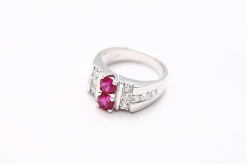 Pink gem stone on diamond ring