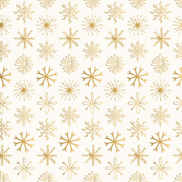 Golden Christmas pattern with creative hand drawn snowflakes. Vintage decorative design.
