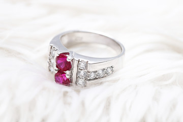 Pink gem stone on diamond ring