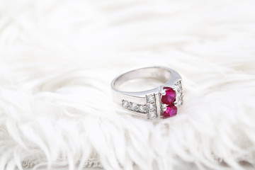 Pink gem stone on diamond ring