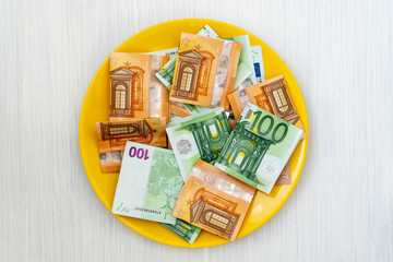Plate with euro banknotes
