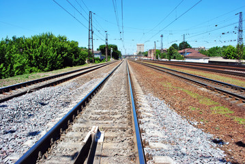 Railway tracks in Kharkiv city, blue sky, bright summer day