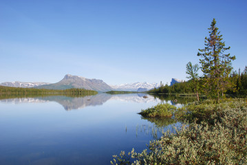 Fototapeta na wymiar The beauty of Laponia Wilderness - Lake Laitaure Water Reflections