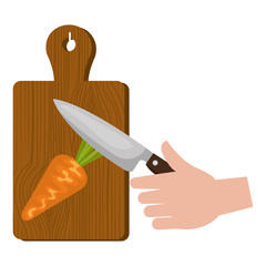 kitchen wooden board with knife cutting carrot