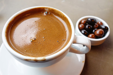 Turkish coffee served with chocolate drops